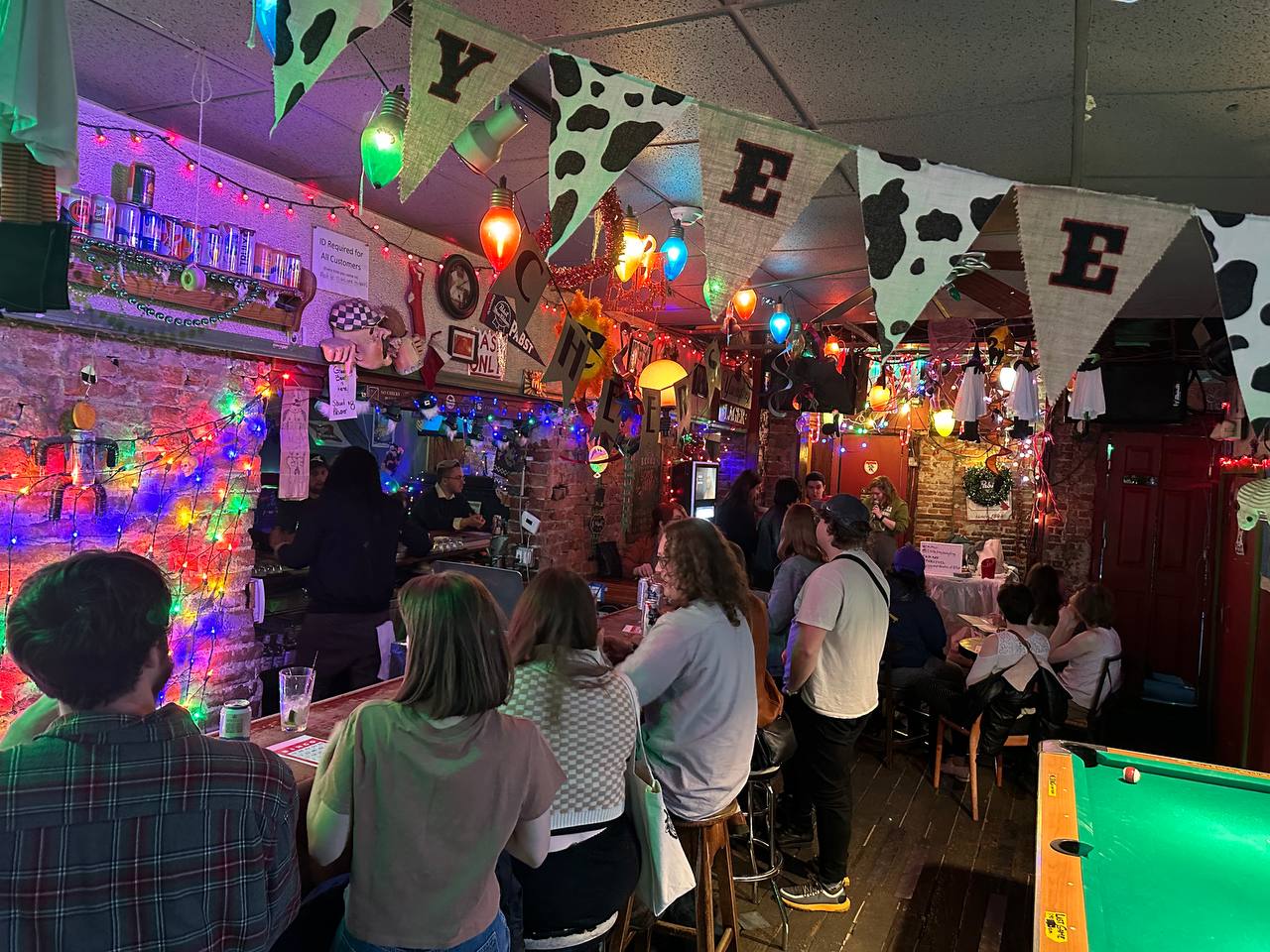 Photo of a bar with many people preparing for a bingo game